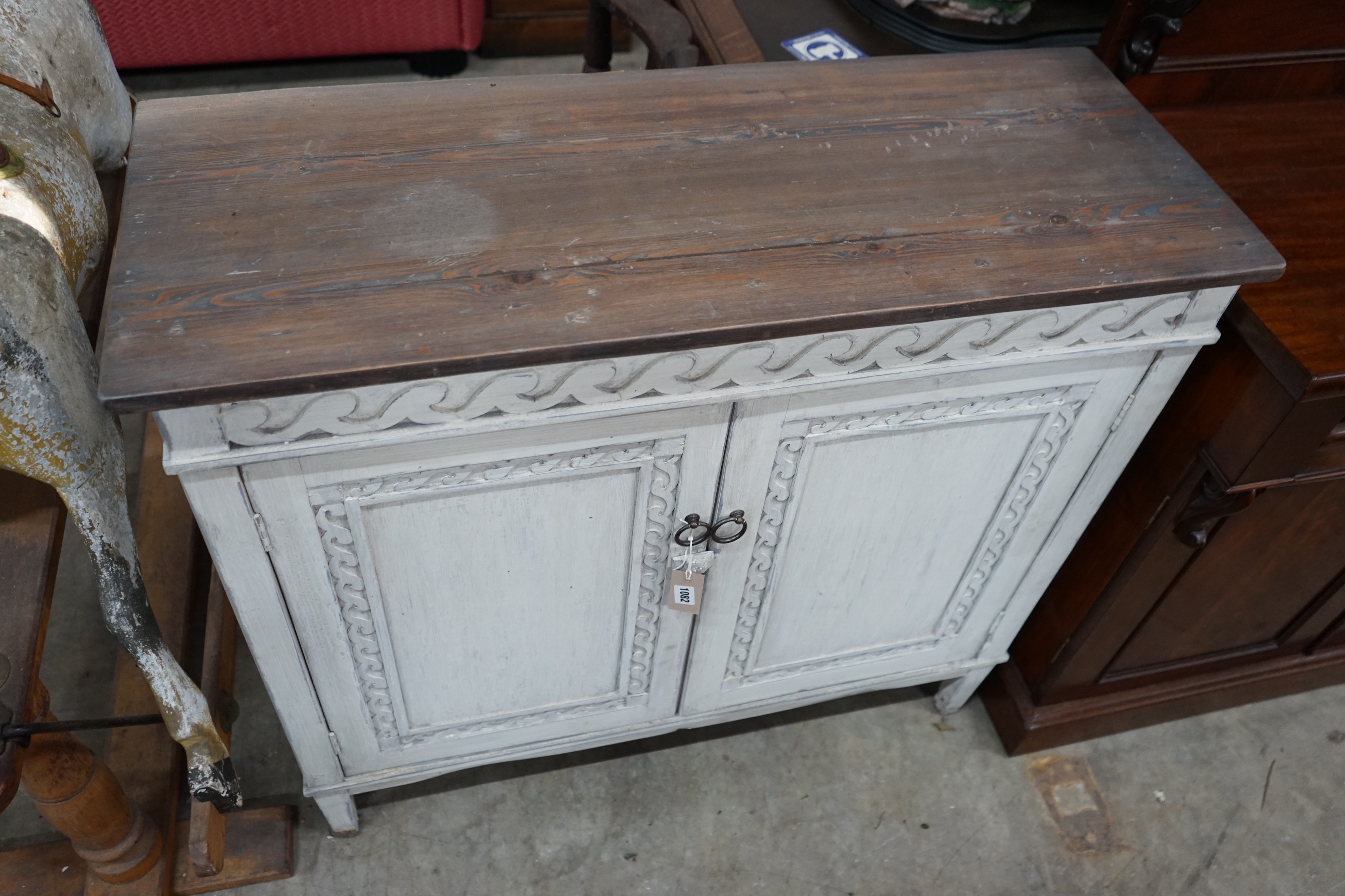A Regency style painted pine two door side cabinet, width 101cm, depth 39cm, height 94cm